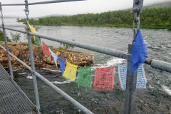 Prayer flags on a bridge before Abiskojaure