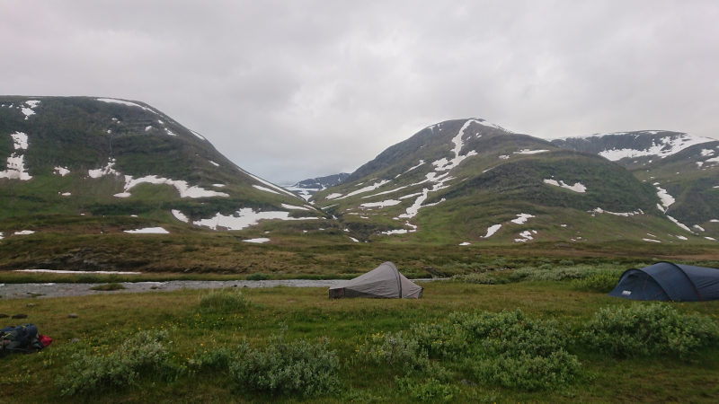 Tent by a river on Kungsleden