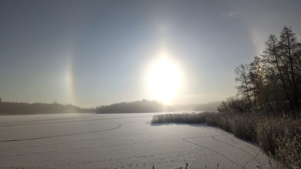 The sundogs optical phenomena over the frozen edsviken. 